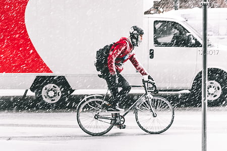 man cycling on snowy weather thumbnail