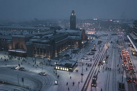 aerial photo of city with snow at night time thumbnail