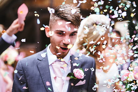 photo of man wearing black suit jacket with flower effects overlay thumbnail
