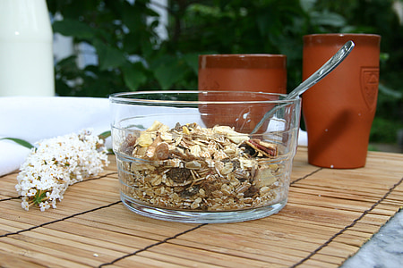 clear glass bowl with cereals and spoon thumbnail