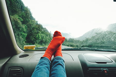 person stepping on black car interior thumbnail