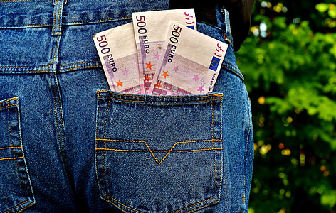 three 500 Euro banknotes on person's pants pouch thumbnail