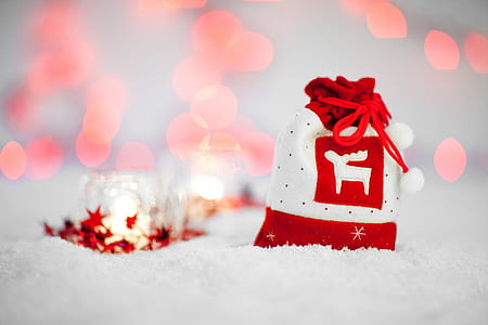 selective photography of red and white drawstring bag thumbnail