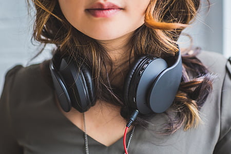 woman with black corded on-ear headphones thumbnail
