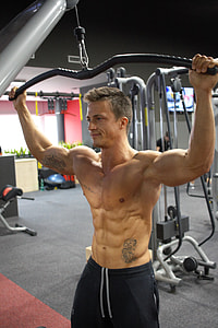 topless man working out at the gym thumbnail