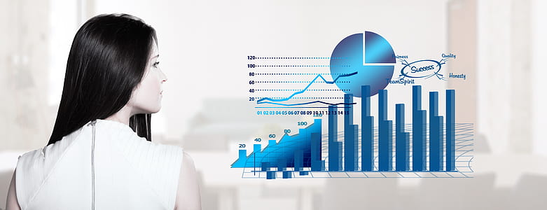 woman standing beside graph thumbnail