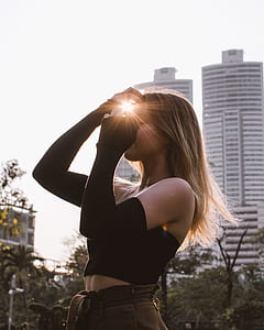 woman standing in front of trees thumbnail
