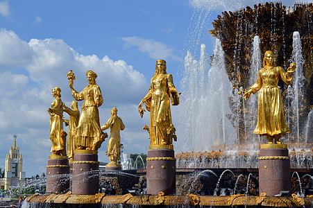 gold statues beside water fountain thumbnail