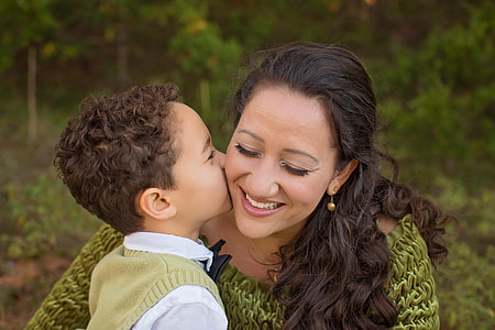 boy kissing woman in tilt photography thumbnail