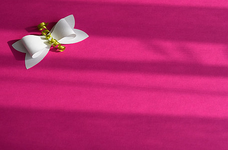 white bow on pink textile thumbnail