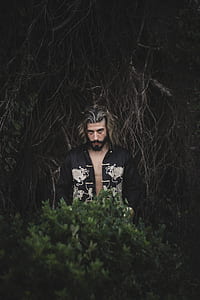man standing near plant thumbnail