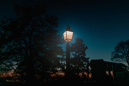 low light photography of light post during nighttime thumbnail