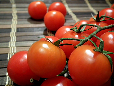 bunch of tomatoes on brown surface thumbnail