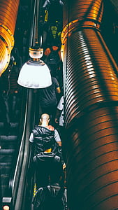 Photo of People Using Escalator Inside a Building thumbnail