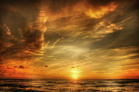 silhouette photo of ocean during sunset thumbnail