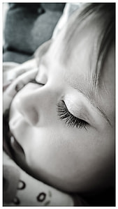grayscale photography of baby sleeping thumbnail