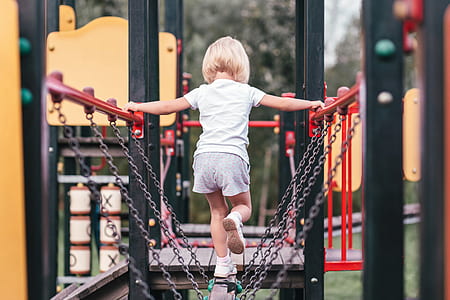 girl standing in chain bridge playground thumbnail