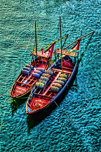 two red barrel boats on body of water painting thumbnail