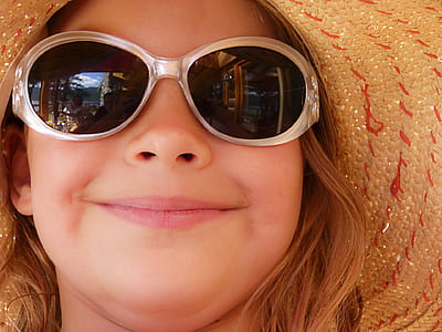 girl wearing sunglasses and brown hat thumbnail