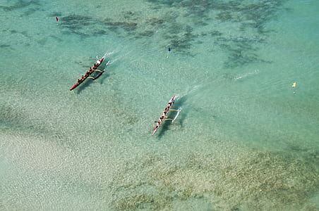 aerial shot photo of two boats running on body of water thumbnail