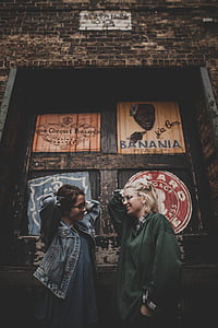 two woman beside window having photo thumbnail