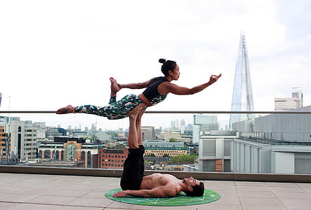 Man And Woman Doing Yoga thumbnail