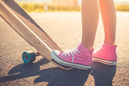 Happy Girl with Pink Shoes Ready to Longboard Ride thumbnail