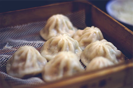 dumplings served on brown box thumbnail