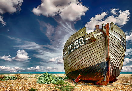 brown and red cruise ship on beach thumbnail