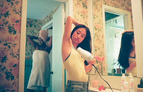 woman blow drying its armpit inside bathroom thumbnail