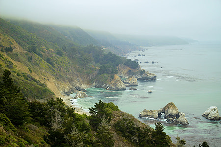 landscape photography of mountain near body of water thumbnail