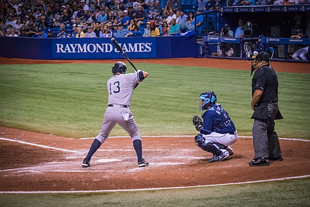 man positioning on baseball bat field at daytime thumbnail