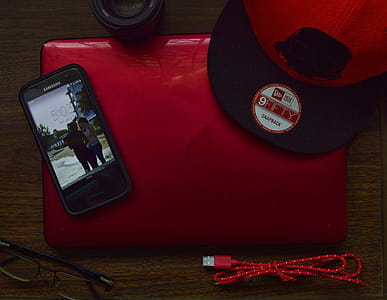 Red and Black New Era 9fifty Snapback Cap and Black Samsung Galaxy Android Smartphone thumbnail