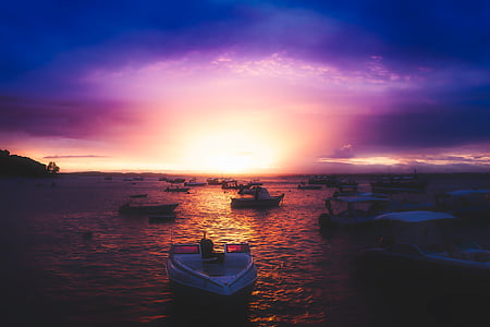white boat photo during sunet thumbnail