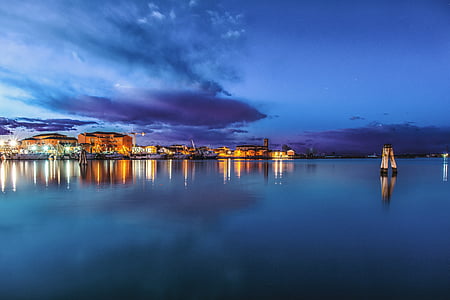 body of water under blue sky thumbnail