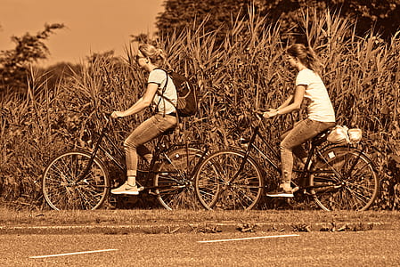 two women riding bicycle outdoor thumbnail