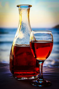 clear glass bottle and clear drinking glass thumbnail