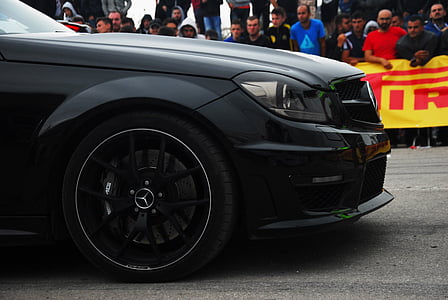 black Mercedes-Benz car on road thumbnail