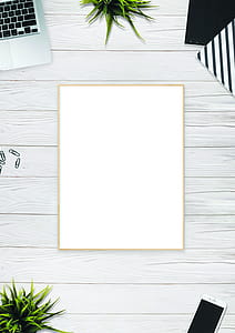 Photo of Brown Photo Frame Near Laptop thumbnail