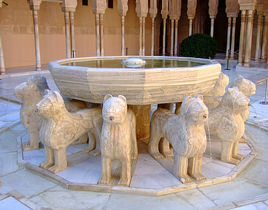 white dog themed fountain at daytime thumbnail