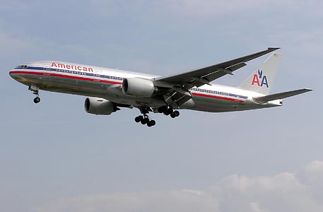 gray American Airlines airplane in flight thumbnail