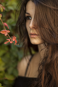 woman in bokeh photography wearing black top thumbnail