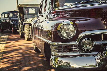selective focus photography of classic maroon car thumbnail