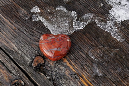 heart brown and gray stone on brown wooden surface thumbnail