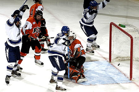 two teams playing ice hockey thumbnail