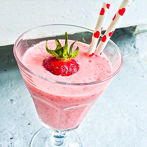 strawberry juice and clear glass footed cup thumbnail