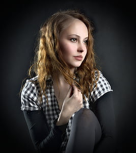 woman in black and white top posing for photo thumbnail