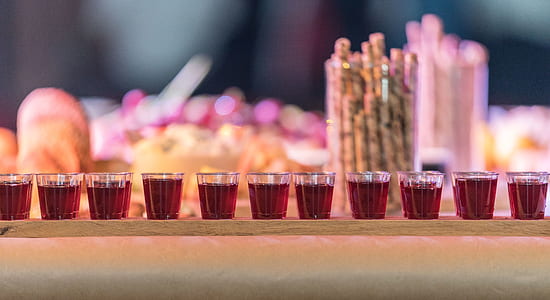 selective focus photography of shot glasses thumbnail