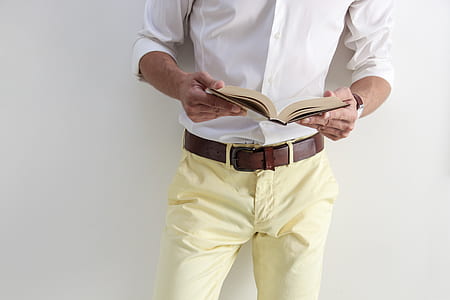 man holding opened book thumbnail