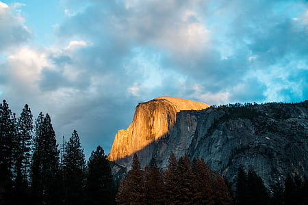 sunlight over rocky mountain during daytime thumbnail